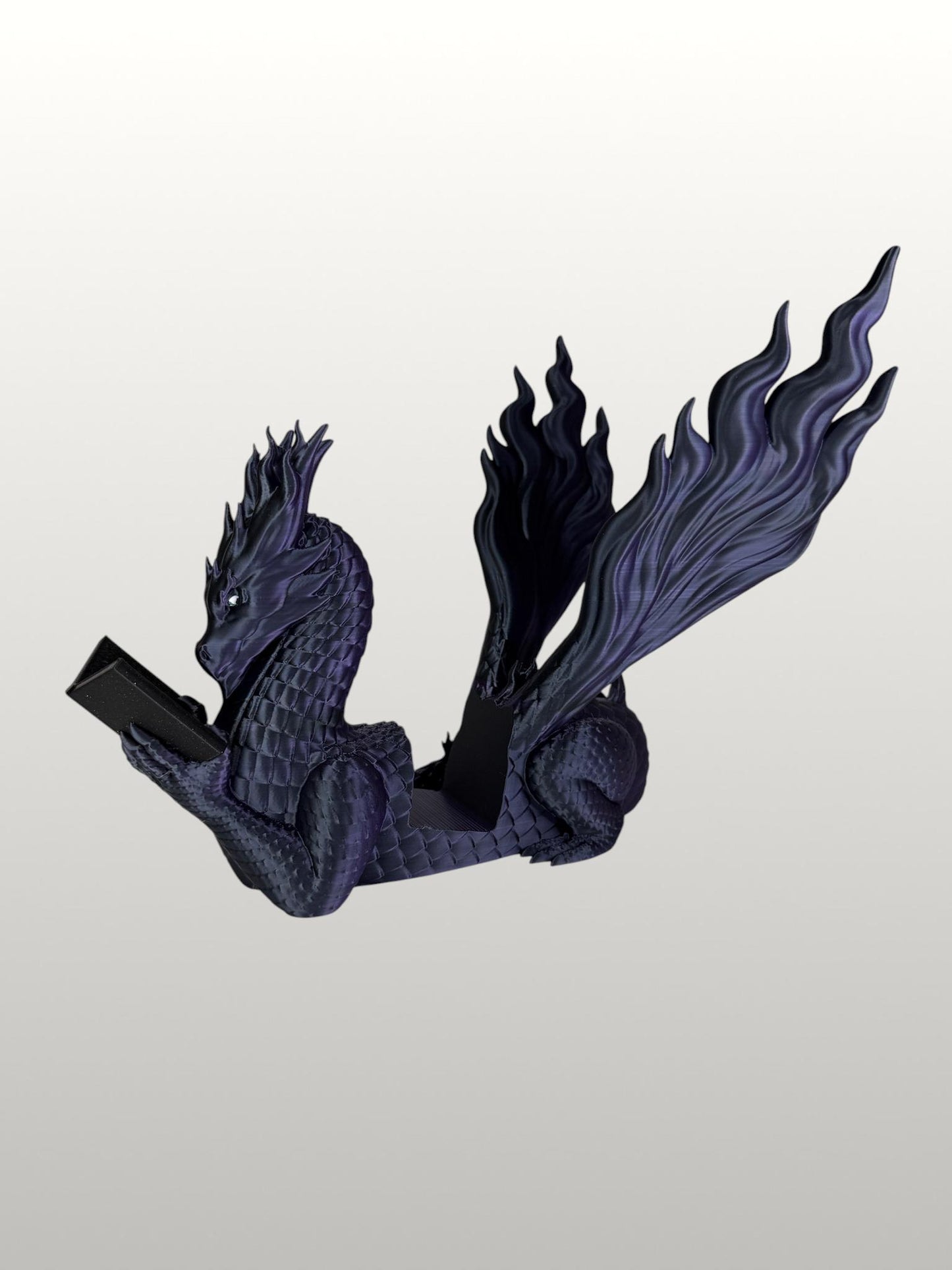 Arcane Dragon cradling an open book, vivid green reptilian eye, and armored scaled claws