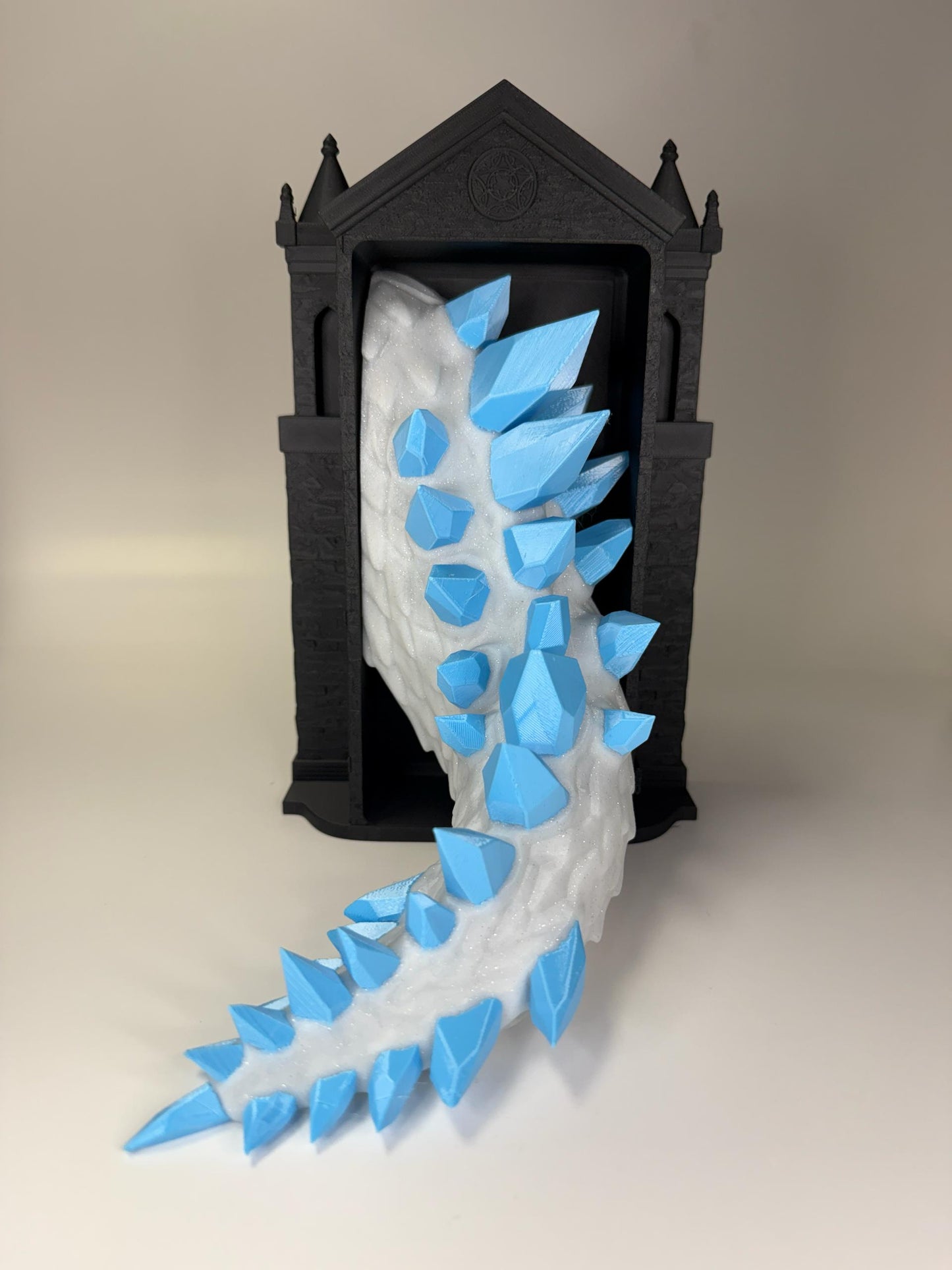 Crystal Dragon tail emerging from gothic frame with cascading white frost and cyan crystal shards
