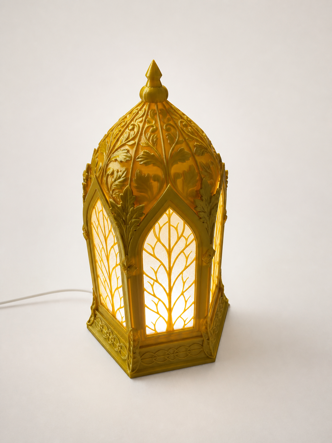 Front view of the illuminated gold Elven Lantern