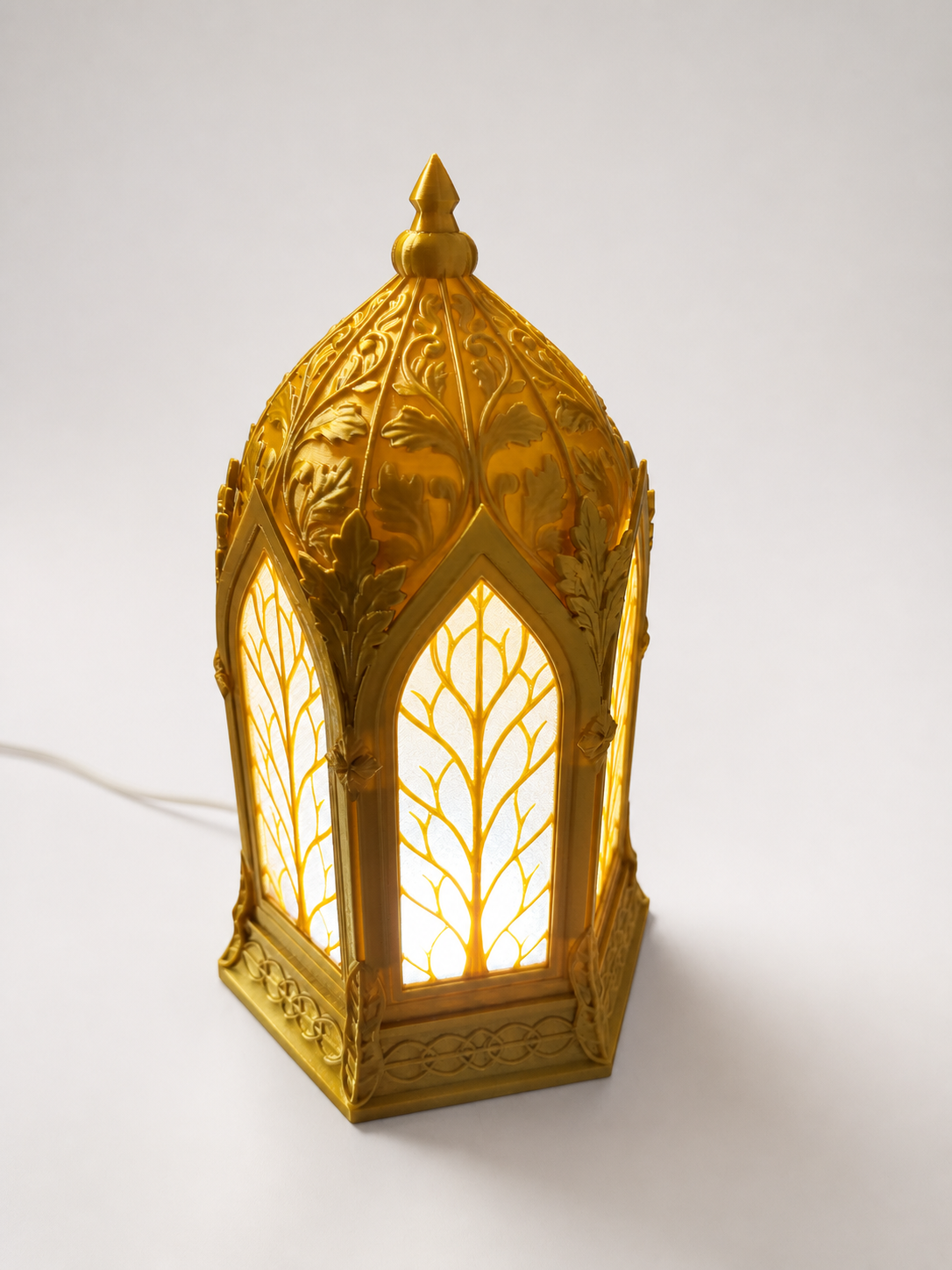 Three-quarter view showing the Elven Lantern's arched panels and leaf details